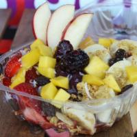 Acai Bowl · Banana, mango, strawberries, granola, dry shredded coconut amd raisins.