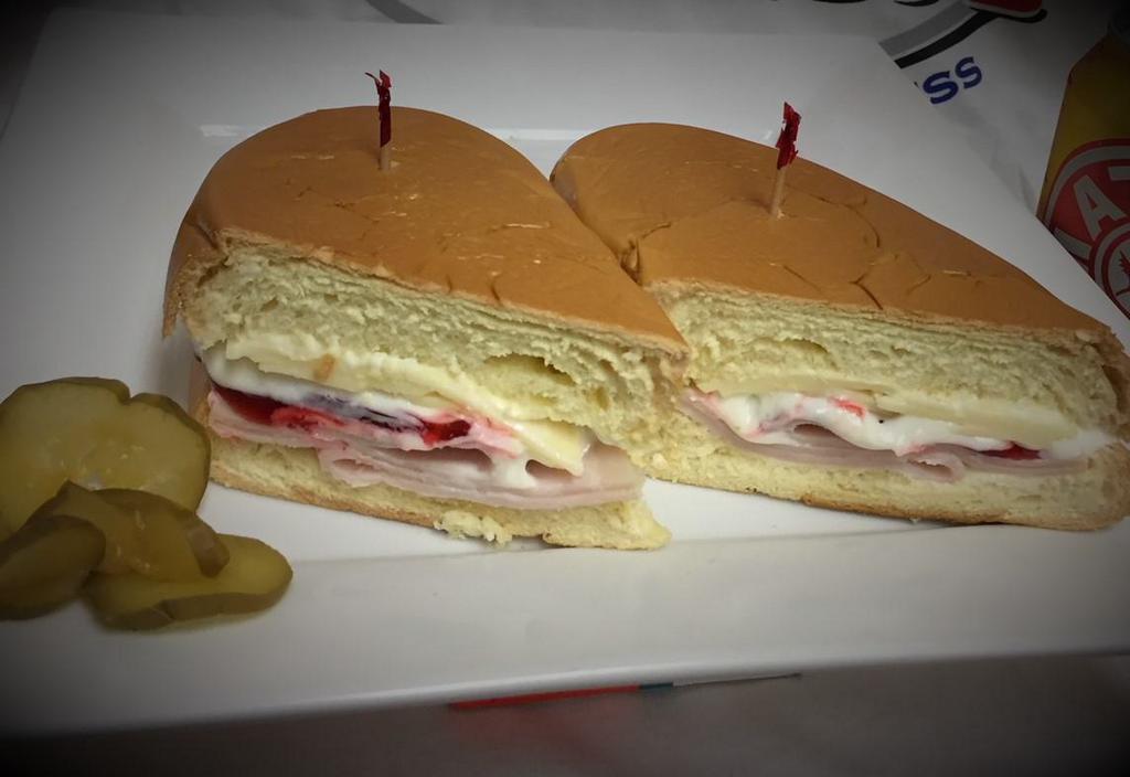 Media Noche · Ham, pork, Swiss cheese and pickles in a sweet bread.