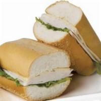 Sandwich de Pavo · Turkey ham, Swiss cheese, mayo, lettuce and tomatoes in a whole wheat bread.