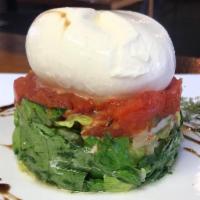 Burrata Salad · Organic locally crafted soft centered mozzarella,
served with romaine lettuce, oregano roast...