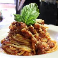 Spaghetti Alla Amatriciana · Crispy pork belly twice cooked, in imported San marzano tomatoes, chili and shaved pecorino. 