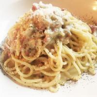 Spaghetti Alla Carbonara  · With organic eggs, cured Italian pancetta and imported pecorino Romano. 