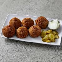 Falafel Plate · Chickpeas and fava beans ground with vegetables and spices, served with tahini sauce, tomato...