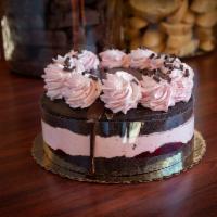 Raspberry Chambord Cake · Dark chocolate cake filled with raspberry jam and house made raspberry mousse, topped with c...