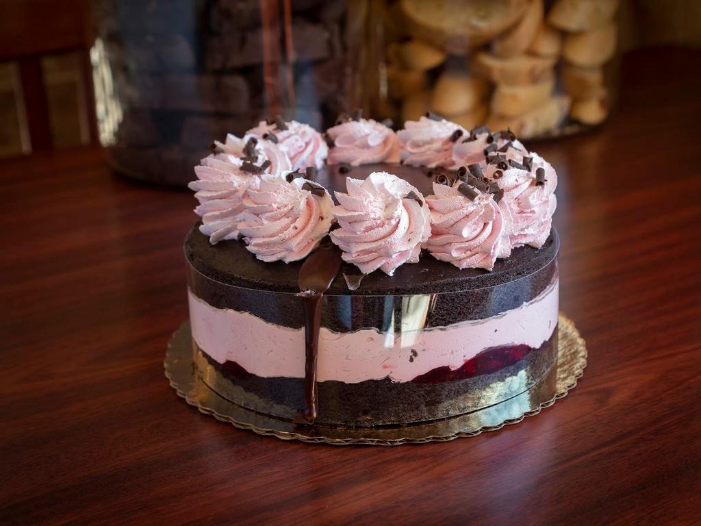 Raspberry Chambord Cake · Dark chocolate cake filled with raspberry jam and house made raspberry mousse, topped with chocolate ganache.