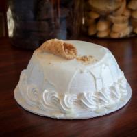 White Cannoli Cake · White cake filled with our famous cannoli filling covered in white Italian cream and white c...