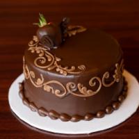 Chocolate Decadence Cake · Rich chocolate cake with a a layer of chocolate mousse and a layer of European chocolate fud...