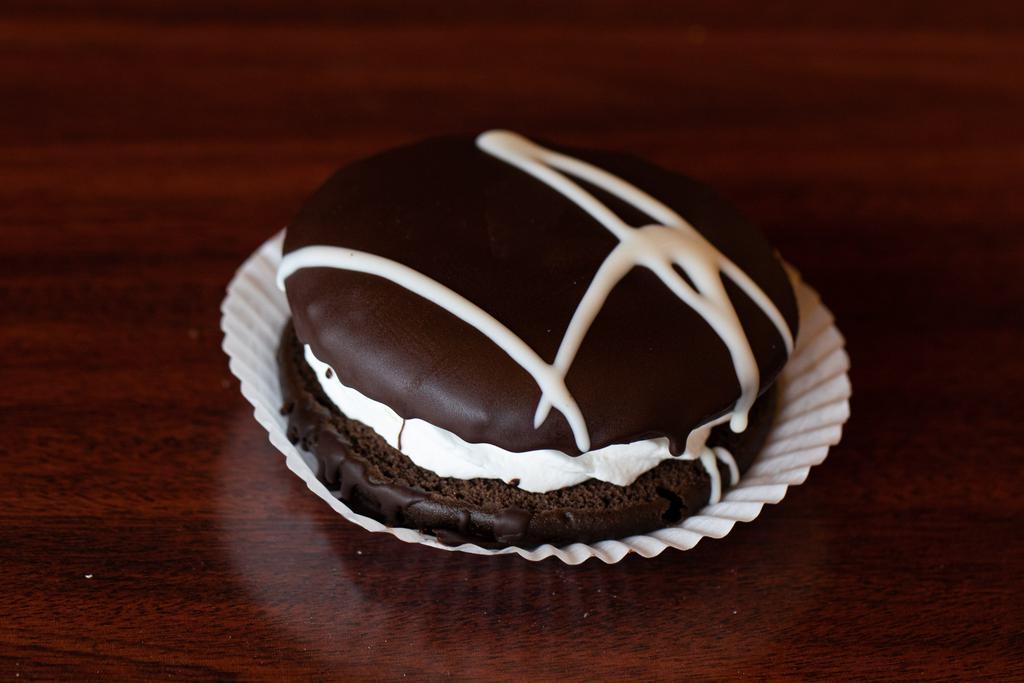 Large Whoopie Pie · Soft chocolate cake with a sweet vanilla buttercream filling dipped in chocolate ganache.  