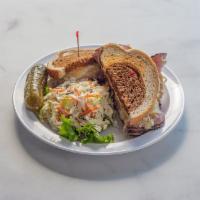 Famous Manhattan Reuben · Choice of pastrami or corned beef, swiss cheese sauerkraut 1000 island on toasted rye. Serve...
