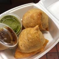 Vegetable Samosas · 2 crisp fried turnover, filled with delicious, mildly spiced potatoes and green peas. Served...