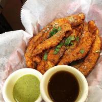 FIsh Pakora · A lightly battered fish fry in Indian spices, ginger+garlic paste, and chickpea flour served...