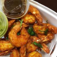 Shrimp Pakora · Marinated shrimp dipped in chickpea flour and fried to perfection. Served with mint and tama...
