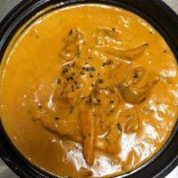 Butter Chicken · Shredded pieces of tandoori chicken cooked with butter in a creamy sauce. Served with basmat...
