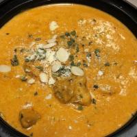 Chicken Korma · Very mildly spiced boneless chicken flavored with coconut and simmered in cream and nuts. Se...