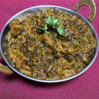 Chicken Saag · Boneless chicken cooked with spinach and topped with spices. Served with basmati rice.