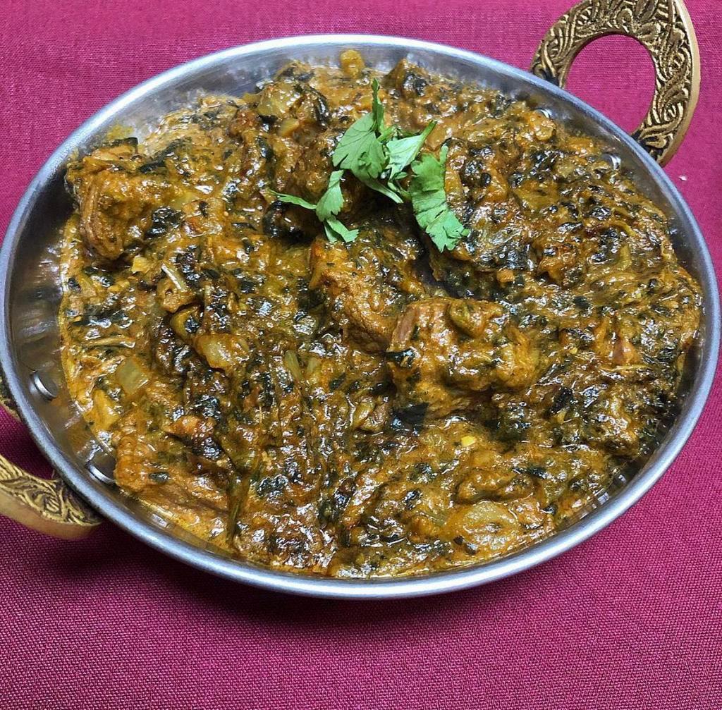 Lamb Saag · Boneless lamb cubes cooked in spinach based curried sauce with a touch of cream. Served with basmati rice.