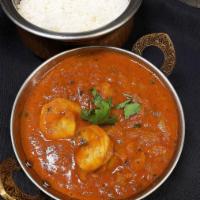 Shrimp Curry · Shrimp cooked with onions, tomatoes in mild spiced gravy. Served with basmati rice.