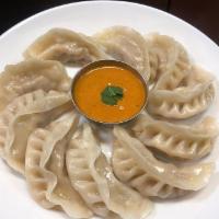 Chicken Momo · Ground chicken with onion, garlic, and Nepali spices wrapped in dough served with momo chutney