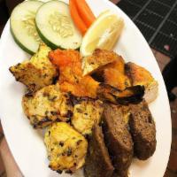 Mixed Grill · A combination platter of tandoori specialties, including tandoori chicken, tandoori shrimp, ...