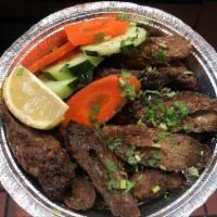 Seekh Kabob · Ground lamb blended with a special mix of spices and cooked on skewers in the tandoor. No rice