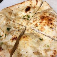 Garlic Kulcha · Leavened fine flour bread stuffed with fresh garlic and herbs. From the clay oven.