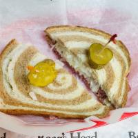 2. Traditional Reuben Sub · Marble rye, corn beef, baby Swiss cheese, sauerkraut or coleslaw and 1000 Island dressing.