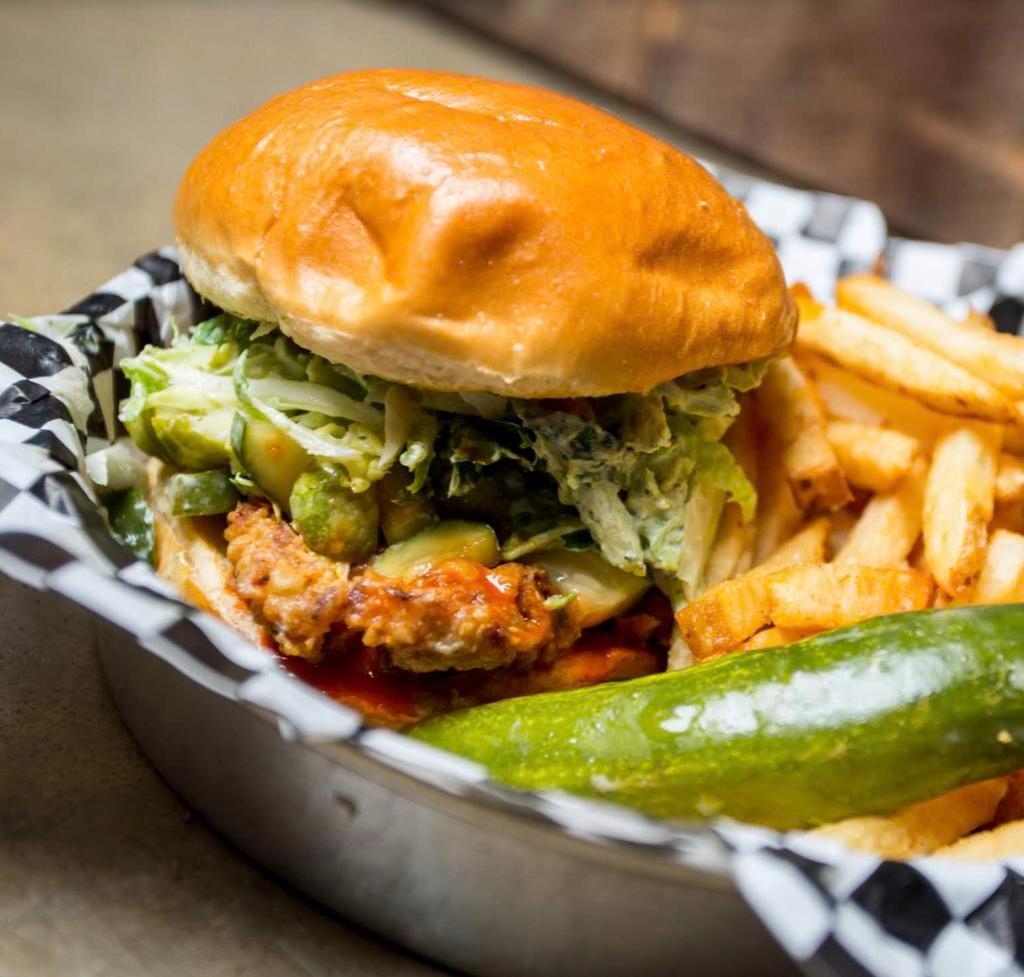 NKC Hot Chicken Sandwich · Pickles, hot sauce and spicy slaw.