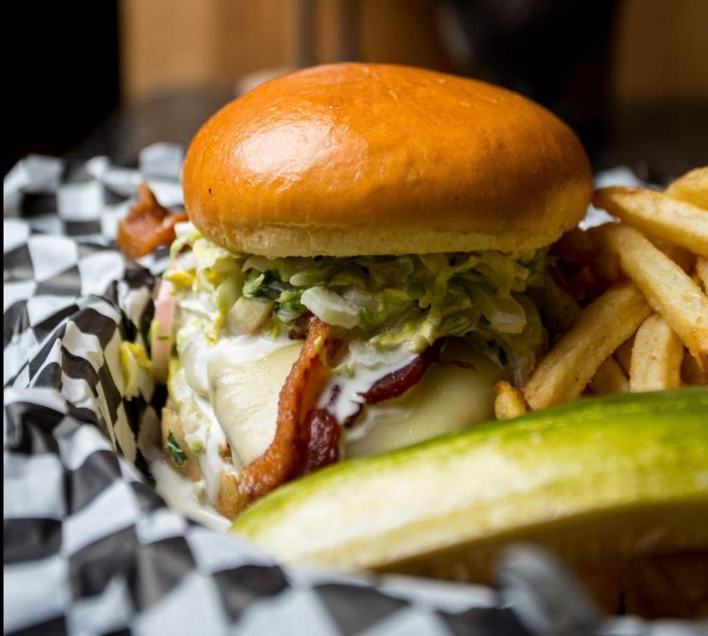 Pickled Chicken Sandwich · Brined grilled chicken breast, bacon, smashed avocado, pickle slaw, Jack cheese.