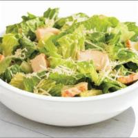 Chicken Caesar Salad · Romaine lettuce topped with grilled chicken breast raised without antibiotics and shredded a...
