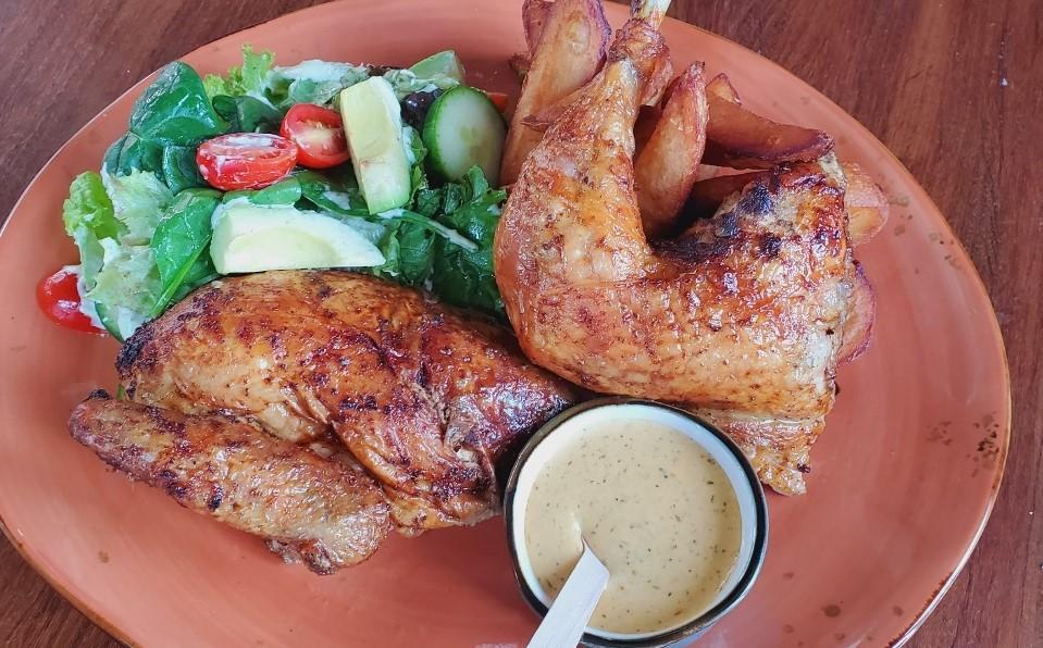 HALF CHICKEN · World famous Peruvian rotisserie half chicken made Jaranita style and served with french fries and green salad