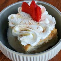 TRES LECHES · Sponge cake soaked in a mix of three different type of milk served with whipped cream strawb...