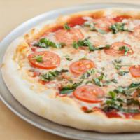 Margherita Pizza · Fresh tomato, garlic, basil, mozzarella, homemade tomato sauce.