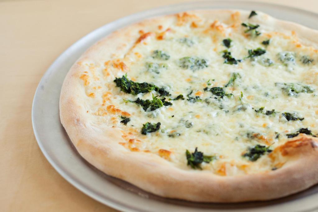White Pizza · Garlic, provolone, mozzarella, spinach, ricotta, homemade tomato sauce.