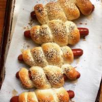 Franklin Dog · All beef or polish dog wrapped in challah bread.