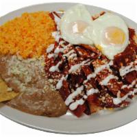 Huevos con Chilaquiles Breakfast · Scrambled eggs with fried tortilla in red or green sauce. Served with rice and beans 