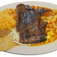 Huevos al Albanil con Carne Breakfast · Scrambled eggs with sauce and steak. Served with rice and beans o