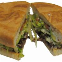 Carne Asada Torta · Grilled steak. Served with beans, cheese, sour cream, lettuce, tomato and avocado.