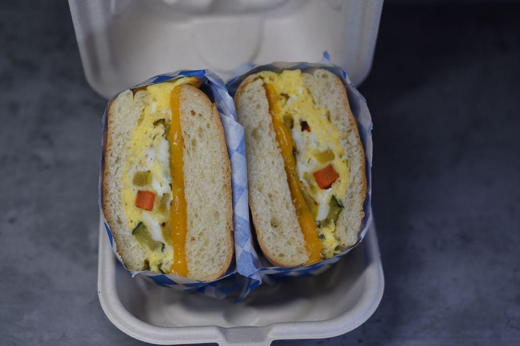 Veggie Egg n cheese · Roasted Veggies cooked in egg, with your choice of cheese serve on our house made ciabatta roll