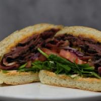 Pastrami  · Juicy Pastrami, pepper jack cheese, chipotle aioli, tomatoes, red onions, pepperoncini's, se...