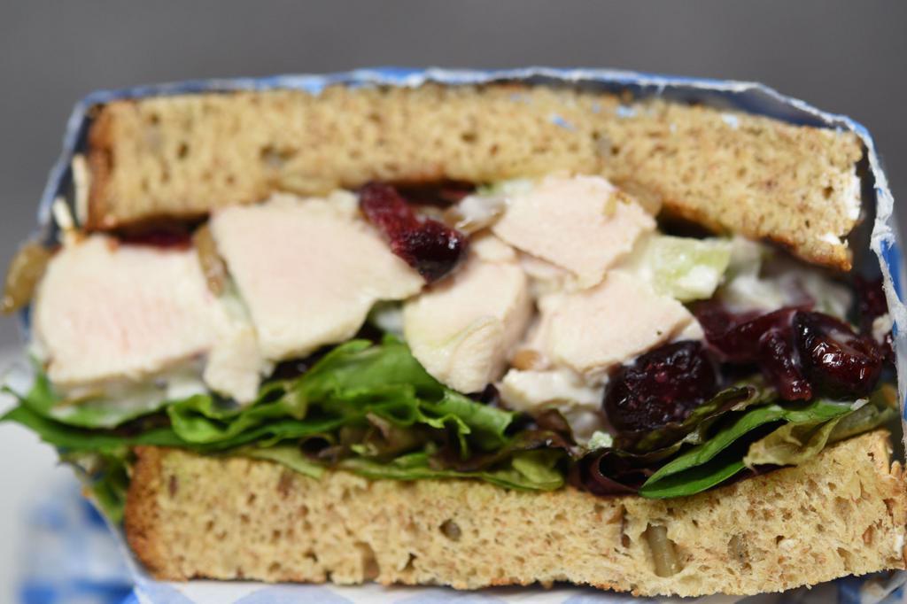 Classic Napa Chicken Salad Sandwich · Marinated chicken with a lemon aioli sauce with savory sunflower seeds, juicy cranberries and crispy celery served on whole wheat and mixed greens