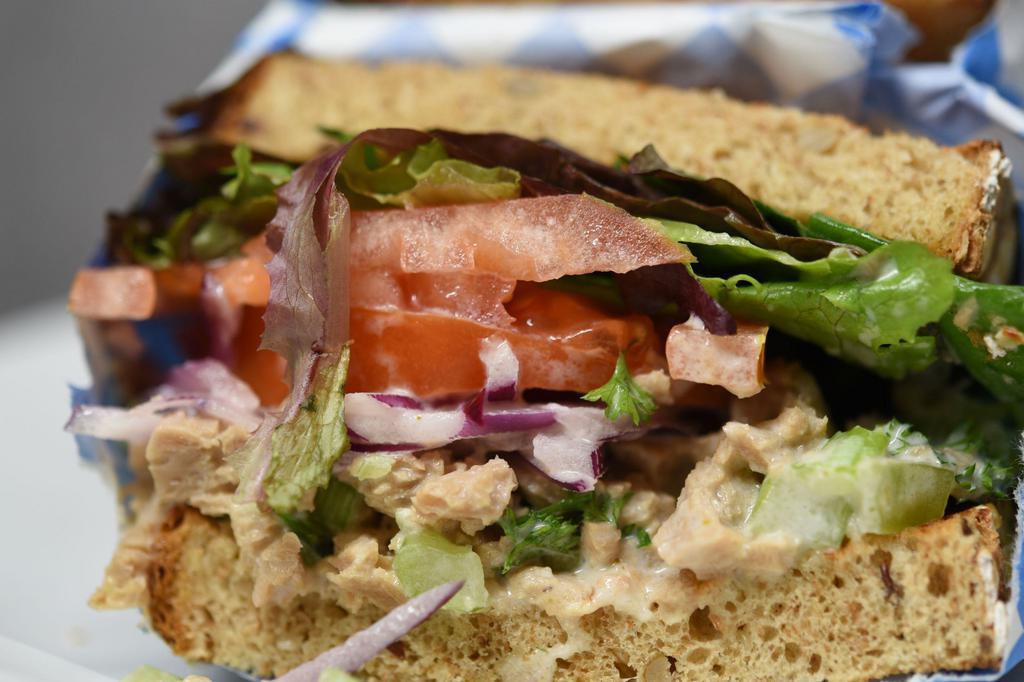 Zesty Tuna Salad · Zesty albacore tuna served with crispy celery, herbs and lemon dressing, mixed greens, tomatoes served on boudins whole wheat bread.