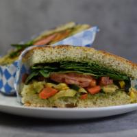 Roasted Veggie Sandwich · Roasted zucchini, summer squash mix with spinach, red onions, tomatoes with pesto sauce on f...