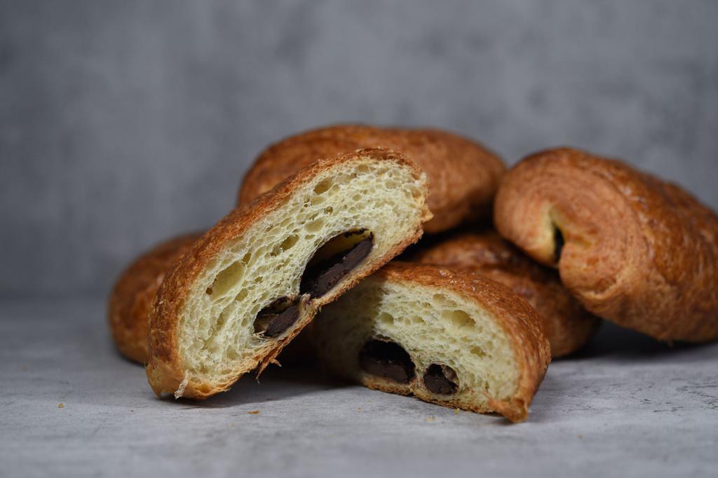 Pain au Chocolat · Flaky butter croissant with 2 sticks of dark chocolate down the middle