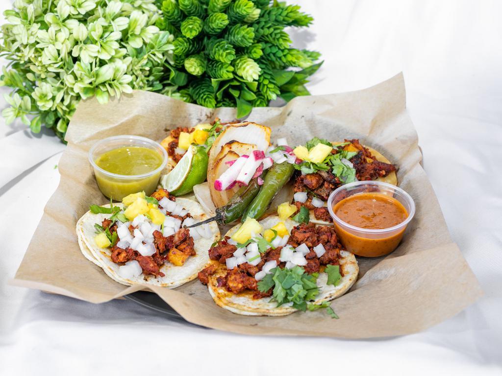Al Pastor Tacos  · Thinly sliced marinade pork and caramelized pineapple, homemade corn tortillas, fresh white onion and cilantro, lime, cucumbers, served  with are family recipe hot red salsa or salsa verde 