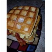 Waffle, Eggs, Bacon, and Cheese Breakfast Sandwich · Served on a crisp and fluffy cake.