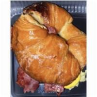 Bacon, Eggs, and Cheese Croissant Breakfast Sandwich · Served on a flaky French pastry. 