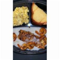 Shrimp, Salmon with Grits Eggs and Toast Breakfast Meal · Porridge made from ground corn.