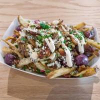Chicken Loaded Fries · Fries topped with roasted chicken shawarma, olives, sumac onions, tabbouleh, feta & labneh h...