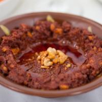 Muhammara · Spicy red pepper paste, crushed walnuts, pomegranate juice and olive oil.