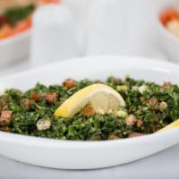 Tabbouleh Salad · Finely chopped parsley, cracked wheat, tomato, onion, lemon, salt and olive oil.